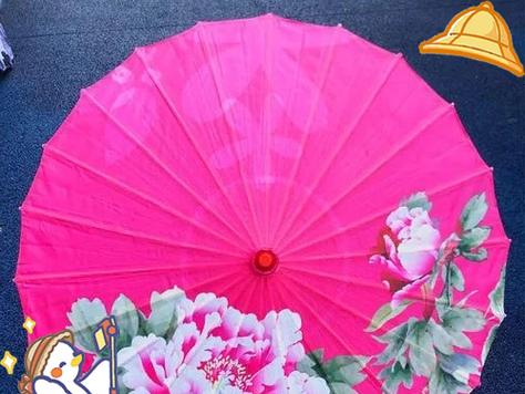 花伞通常象征着什么？它在不同文化中有何不同含义？